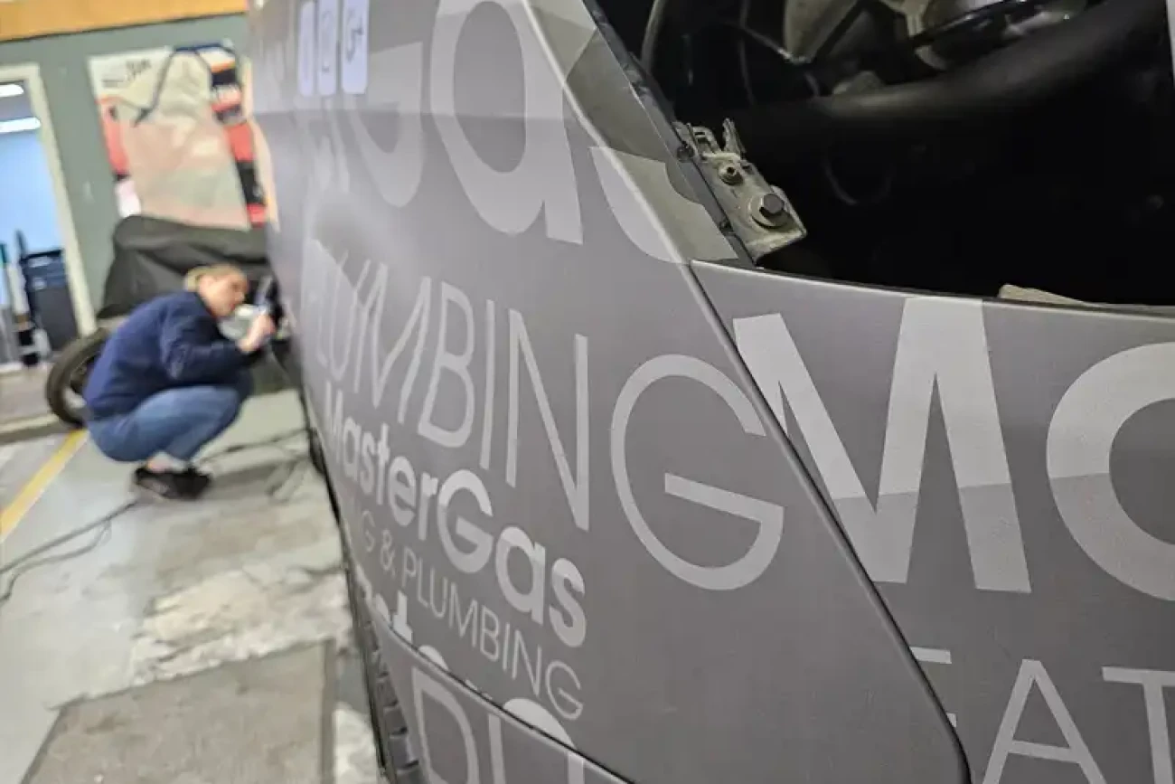 Close-up of commercial van wrap installation with printed vinyl graphics being applied at Wrap Your Car Kidderminster