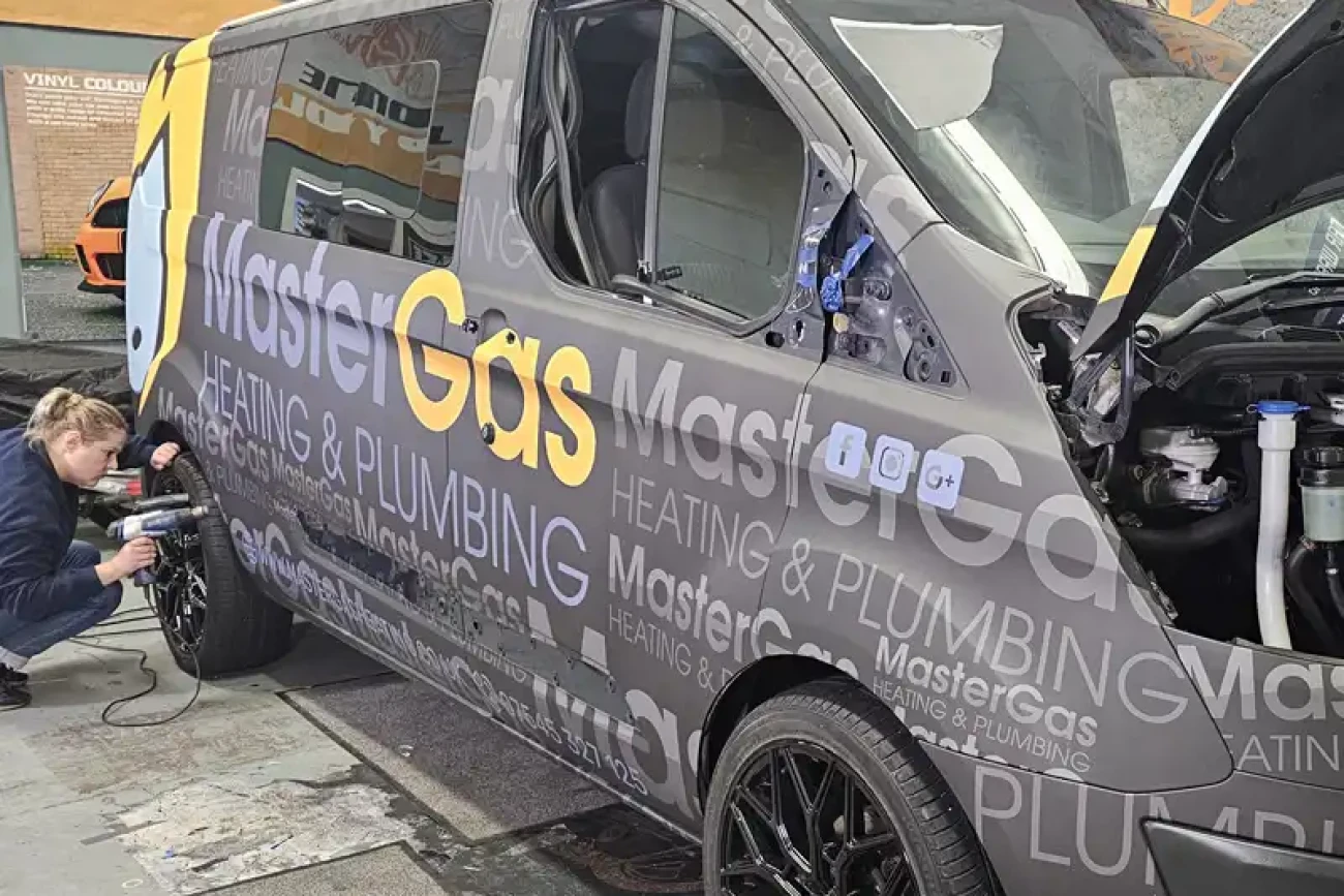 Commercial van wrap installation in progress with printed graphics at Wrap Your Car Kidderminster