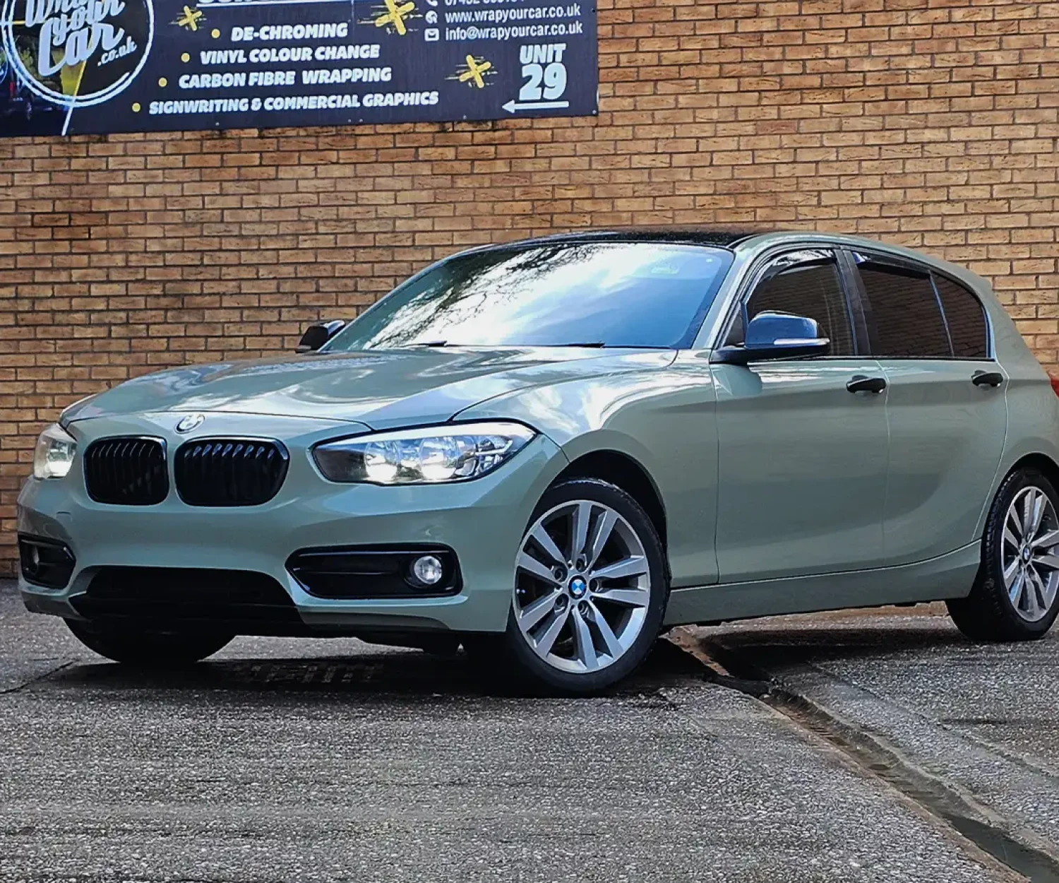 Full colour change vinyl wrap in khaki green on BMW 1 Series